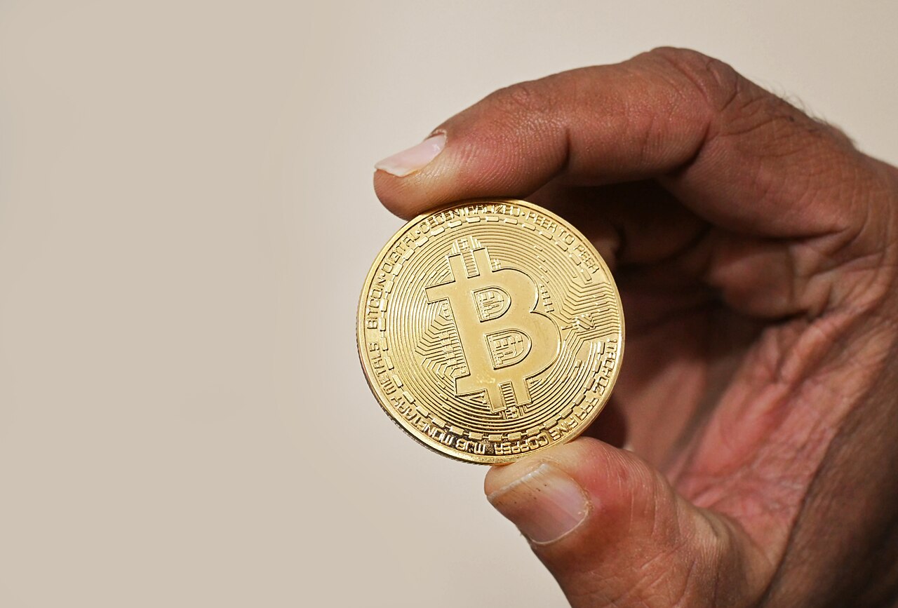 Holding Bitcoin cryptocurrency coin